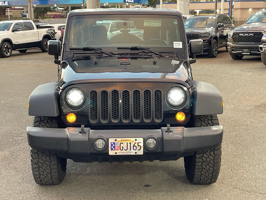 2017 Jeep Wrangler Rubicon 4x4 in Black Clearcoat — front three-quarter view