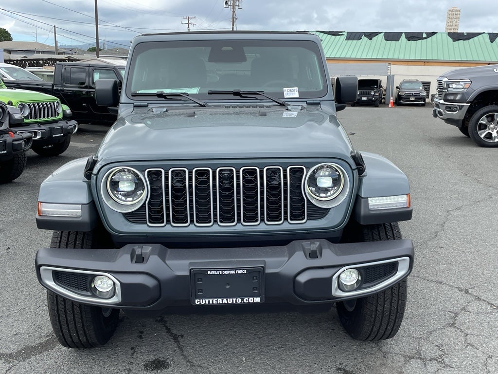 2026 Jeep Wrangler WRANGLER 4-DOOR SAHARA in Anvil Clear-Coat Exterior Paint — front three-quarter view