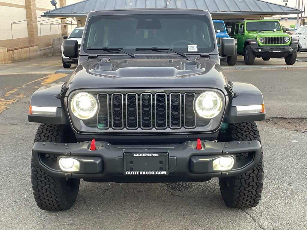 2026 Jeep Wrangler WRANGLER 4-DOOR RUBICON in Granite Crystal Metallic Clear-Coat Exterior Paint — front three-quarter view