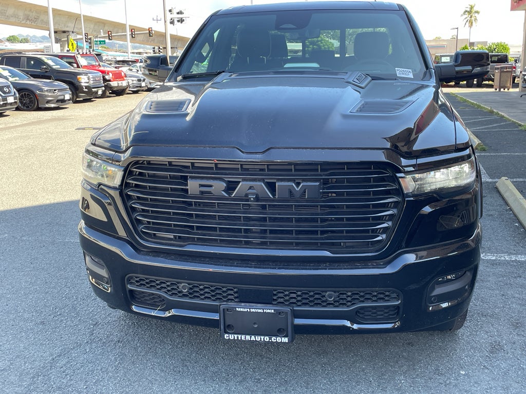 2026 RAM Ram 1500 RAM 1500 LARAMIE CREW CAB 4X4 5'7' BOX in Diamond Black Crystal Pearl-Coat Exterior Paint — front three-quarter view