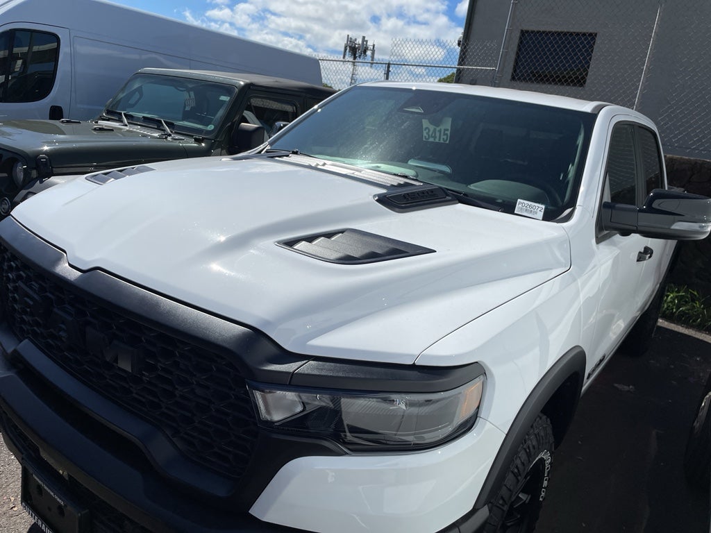 2026 RAM Ram 1500 RAM 1500 REBEL CREW CAB 4X4 5'7' BOX in Bright White Clear-Coat Exterior Paint — front three-quarter view